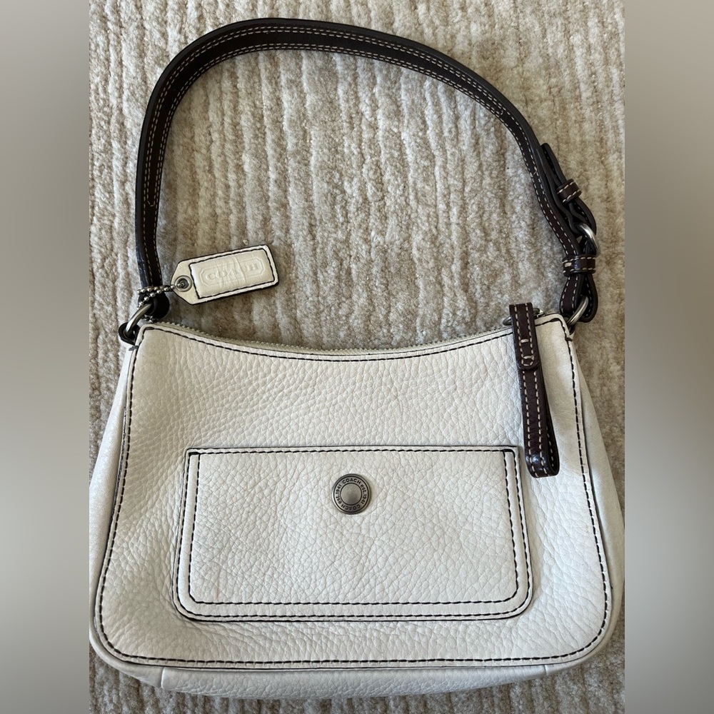 Like new- White pebble leather, silver hardware. Chocolate brown strap & stitch